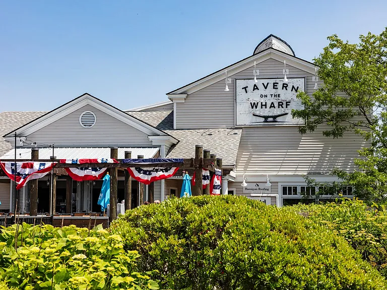 Relax with waterfront dining at Tavern on the Wharf, a local favorite near Modera South Shore.