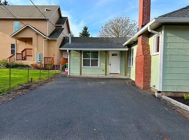 Unit A is at the back of the paved parking that belongs to the neighbor. 
There is ONLY street parking available.