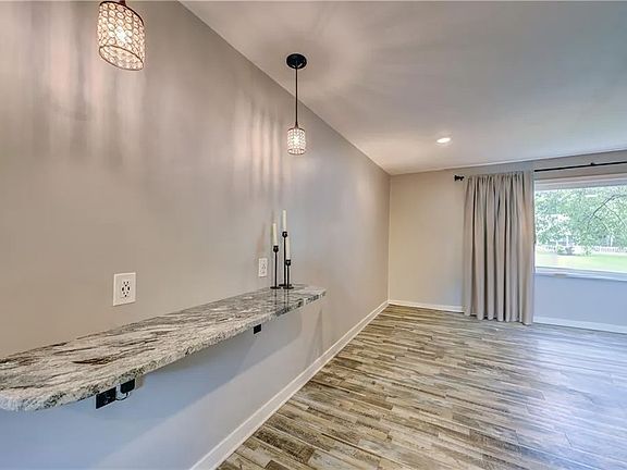 An area for bar stools and dinner table at 7550 Booth Drive, Prairie Village, Kansas