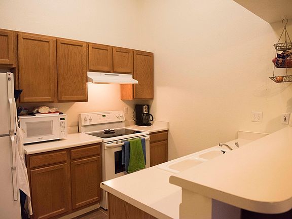 Kitchen: microwave, oven, dishwasher, and wash and dryer in 