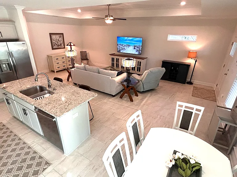View of great room and kitchen from side patio entry