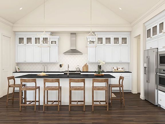 Kitchen with pendant lighting and upper glass cabinets