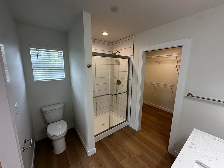 Attached en suite bathroom with walk in closet attached.
