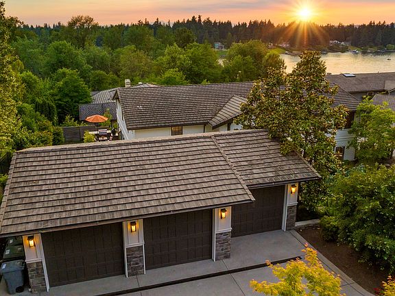 Three car detached garage with ample parking for guests
