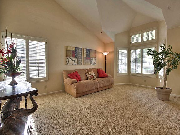 Large living room with plantation shutters