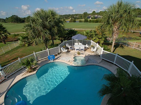 Upstairs view of pool to golf