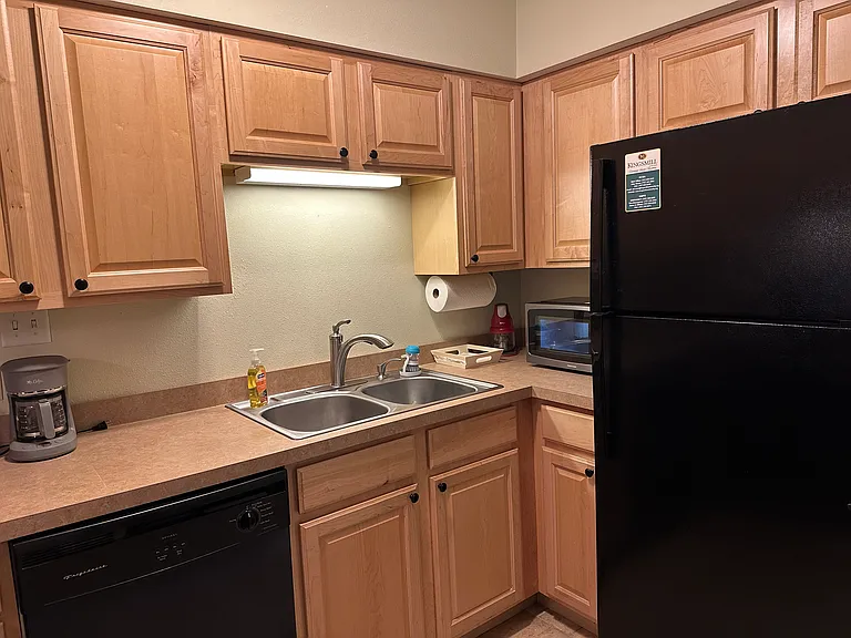 Kitchen also includes full size refrigerator and microwave.
