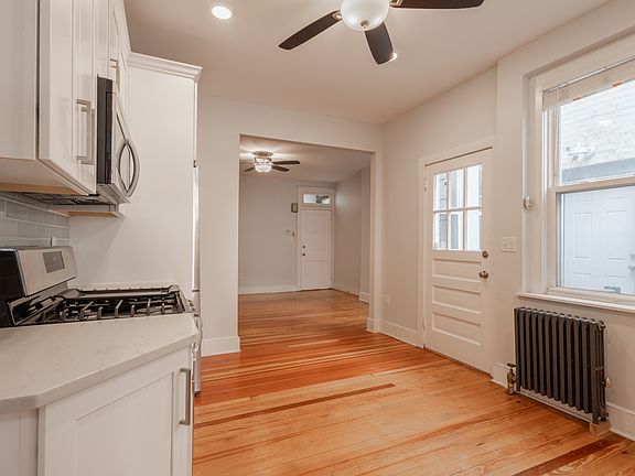 Kitchen looking into living room