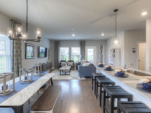 Prepare dinner in the kitchen while the kids hang out in the great room.