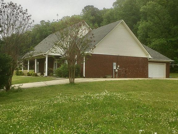 Right side view of home with side garage