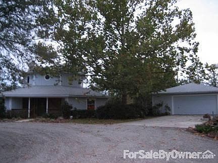 View of the Front
						:
						Master bedroom and master bath with windows galore upstairs. Detached garage.