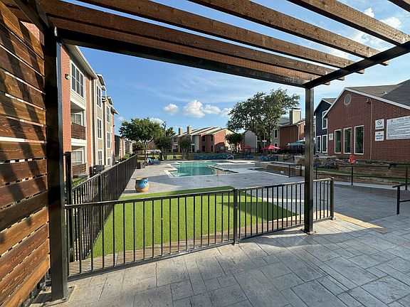 Turf lounge area by main pool
