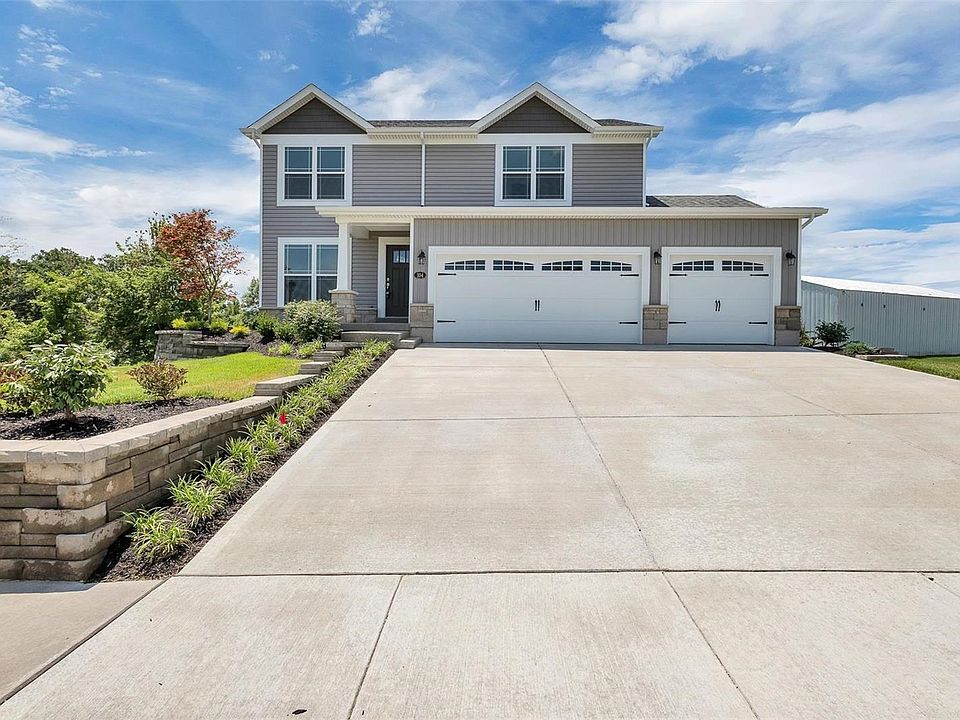 DISPLAY FOR SALE - LOADED WITH EXTRAS! FINISHED 3 CAR GARAGE (WITH SEPERATE HEATING & COOLING), window panels in the garage door, Beautiful stone work, hallmark columns, architectural shingles, irrigation system & professionally landscaped. FARM VIEWS FRONT & BACK!!