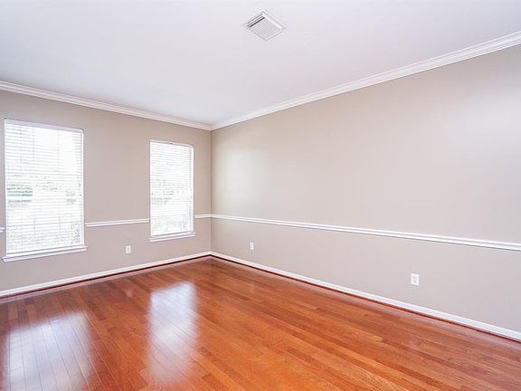 Very large formal living room or study with molding.