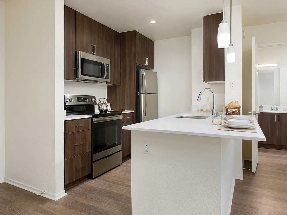 Premium Apartment Kitchen with Stainless Steel Appliances - eaves Seal Beach