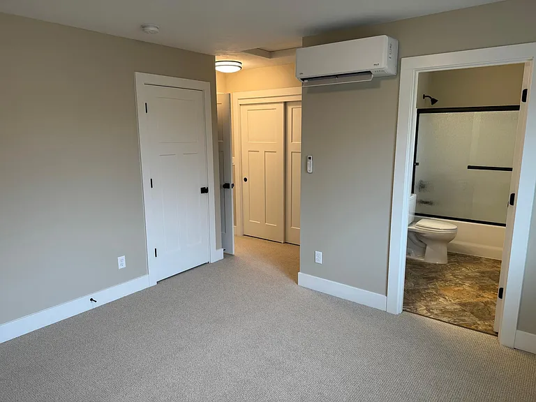 The spacious front on suite with two closets.