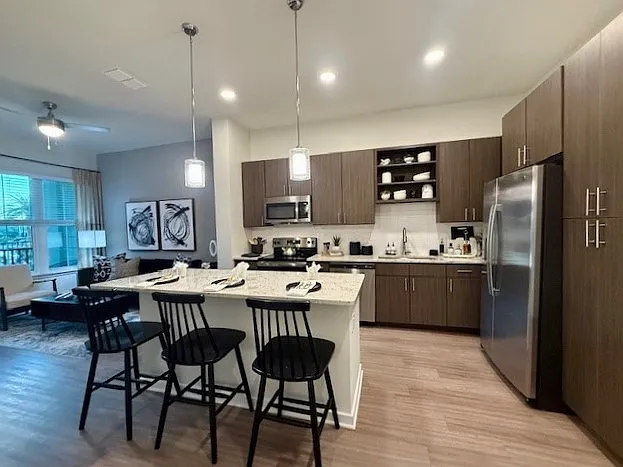 Integra Palms: Explore a stylish kitchen and living space perfect for modern living.