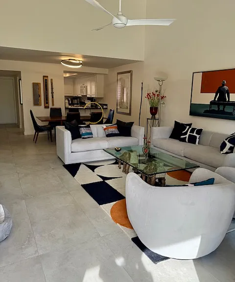 Living/dining area with kitchen in rear.