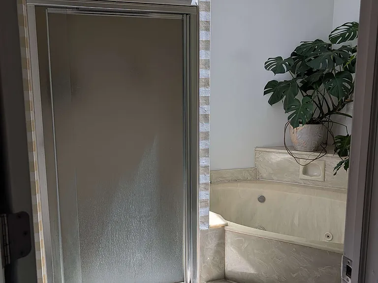 Second-floor shower and a separate hot tub