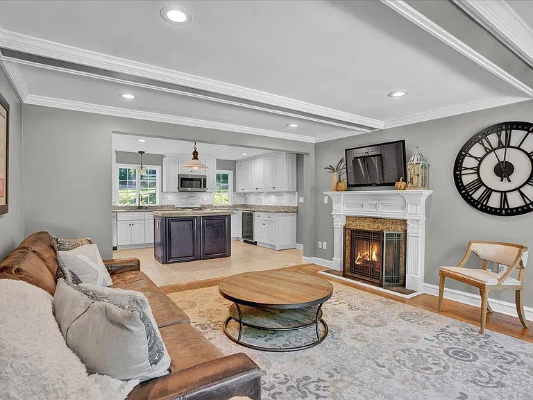 Family Room, coffered ceiling, direct access to pool