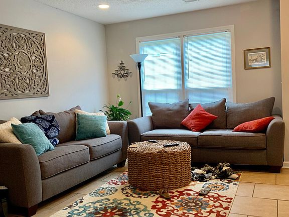 Tile floors keep the townhouse cool during the host and humid summer months