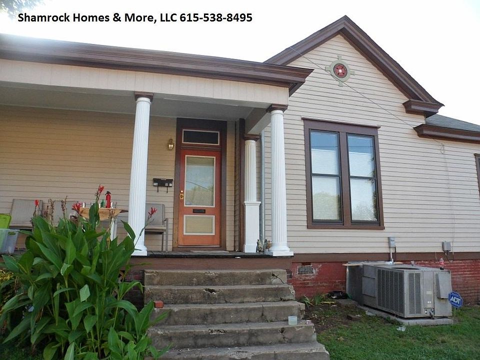 Exterior front- wonderful front porch with room for lounge c