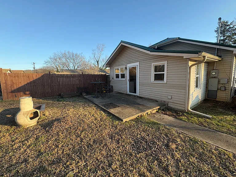 Back of house with patio