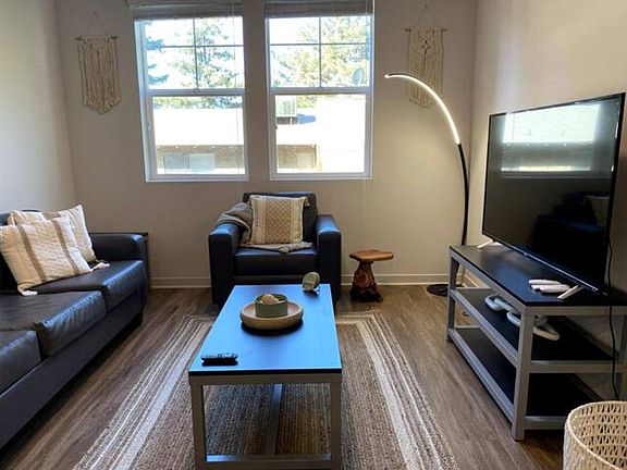 Kick back in the thoughtfully decorated living room and enjoy a program on our 55" SmartTV! Hulu, Netflix, and Disney+ are provided for your enjoyment.