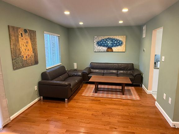 Living room with couches and coffee table.