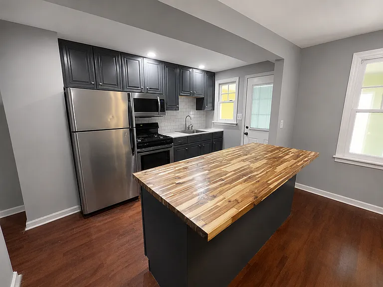 Fully renovated Kitchen Featuring Butcher Block Island & Stainless Steel Appliances