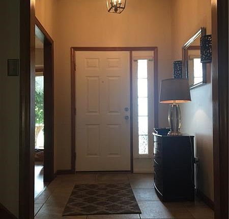 10 foot high ceilings greet you in the 11x06 entry hall with 18"x18" ceramic tile floors.