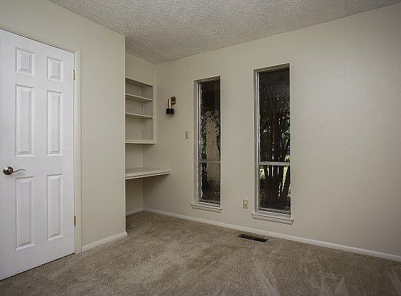 Living room has built in desk