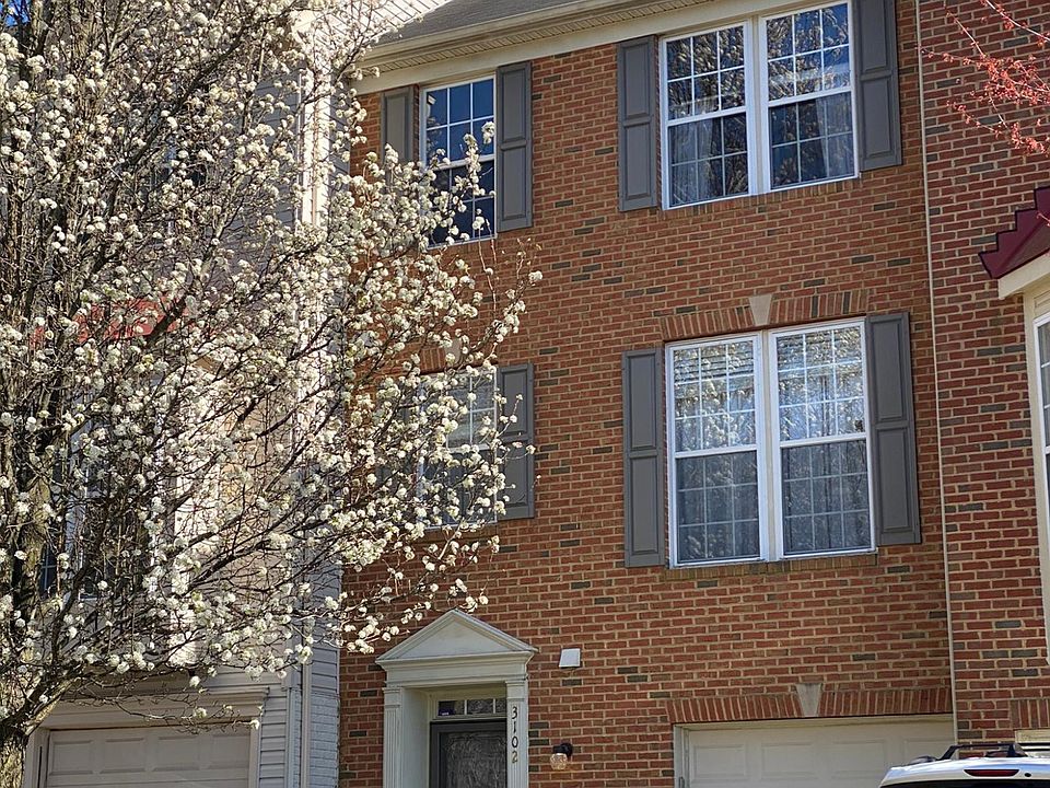 Front of home. Entrance with private driveway and single car garage.