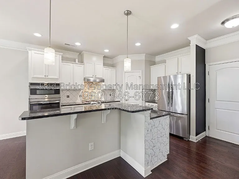 9659 Camberley Ave NW — Photo 13