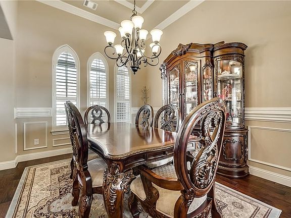 Formal dining with plantation shutters.