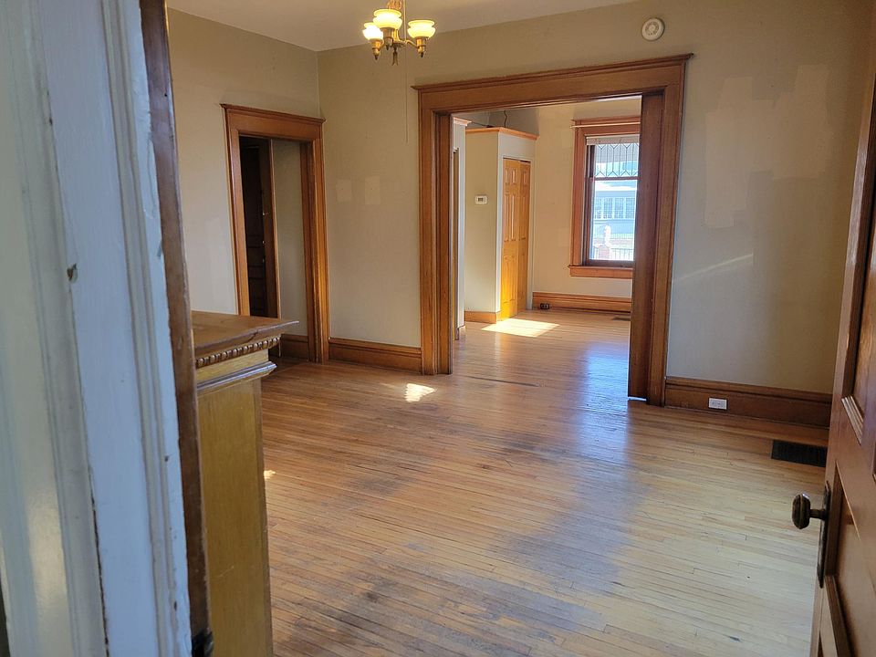 Living room and view into bedroom 1