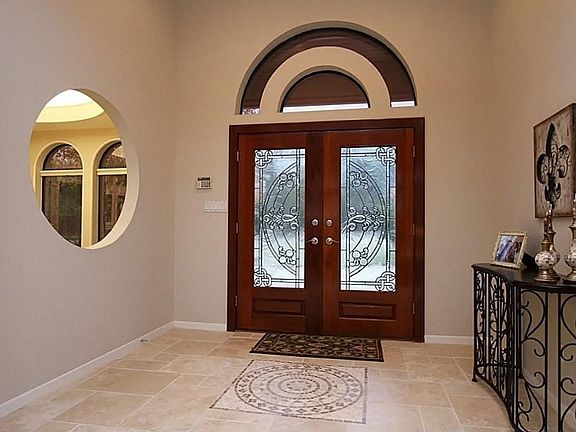 Gorgeous double doors allow lots of natural light into the welcoming foyer!