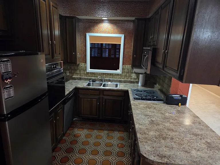 Kitchen. Large pantry next to fridge. Fridge included