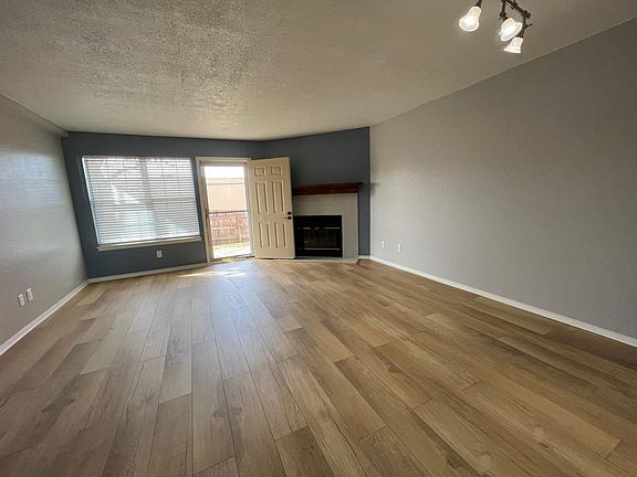 Living/dining room, fireplace, door to back patio