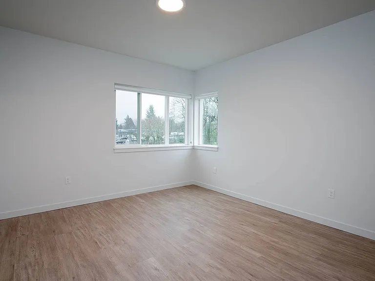 The Byway | #201 Large Primary Bedroom with Plank Flooring
