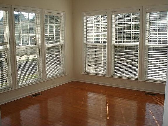 Morning room/ Sunroom w/ windows on 3 sides.  Blinds convey