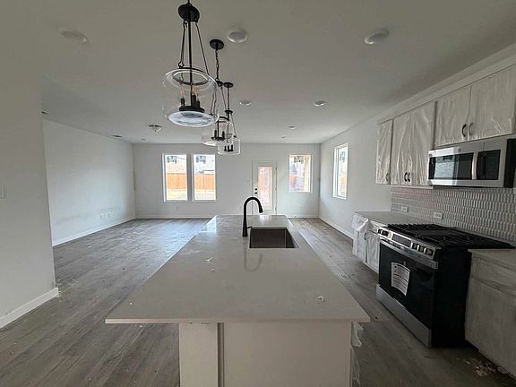 Open Kitchen-Living-Dining Room Construction Progress featuring the Harmony Collection