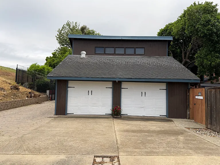 One garage space and one off street parking space is included. Extra storage is available in the garage which included automatic openers.