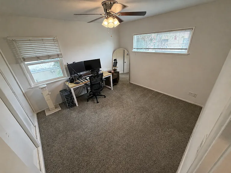 2nd bedroom with recently installed carpet for comfort and sound proofing ( installed Jan 2026)