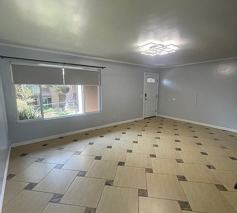 Living room has custom window shades