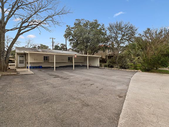 Carport is in front of the detached apartment
