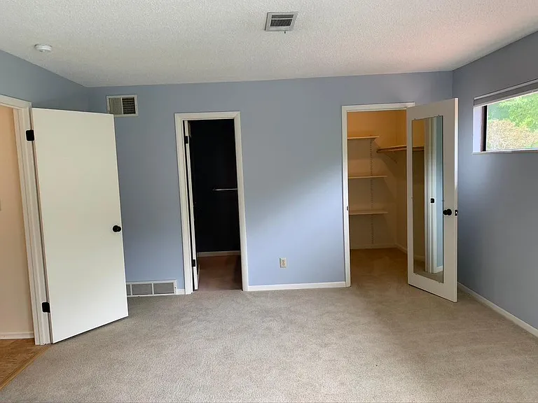 walk in closet and bathroom