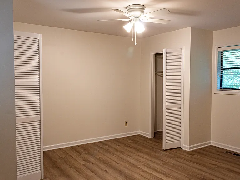 On the east side of the second floor, the master bedroom features a closet and a window on each of the north and south walls.