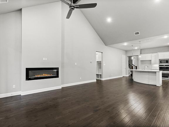 REPRESENTATIVE PHOTO - Living room in the Waldorf home plan by Trophy Signature Homes