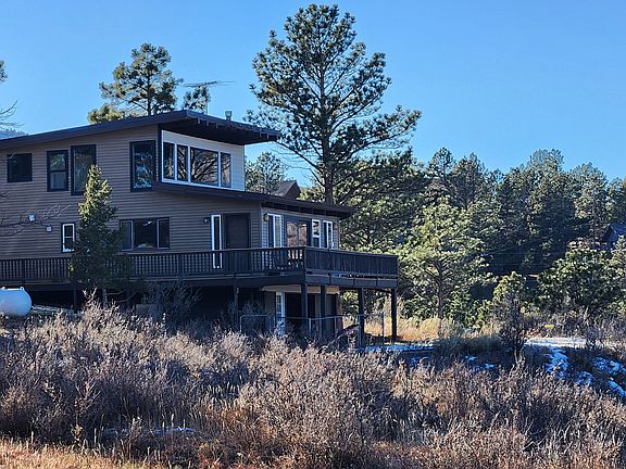 Back side of house. Surrounded by open space on 2 sides.